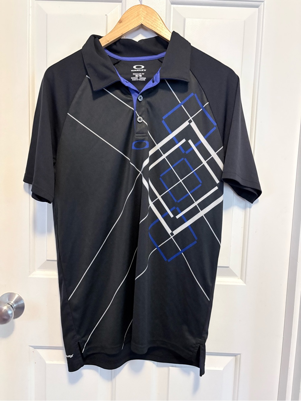 Oakley Black Polo with Blue and White Geometric Accents